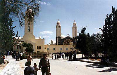 Front view of St. Mina Monastery in Mariut showing the church of St. Mina (front left) and the new Cathedral with its two towers (on the right in the back)
